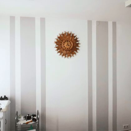 Medinis saulės formos laikrodis